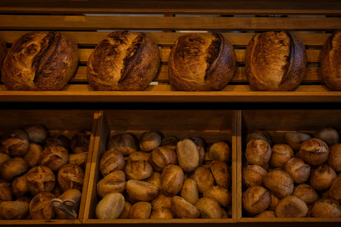 Shelves of freshly baked loaves in a bakery